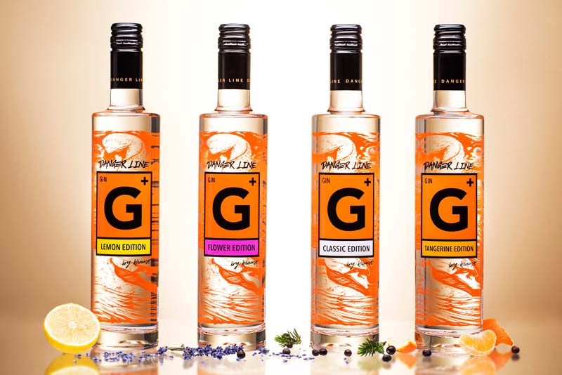 4 bottles of Danger Line Gin from Distillery Krauss: Classic, Lemon, Tangerine and Flower. 500 ml. Tall, slim bottles